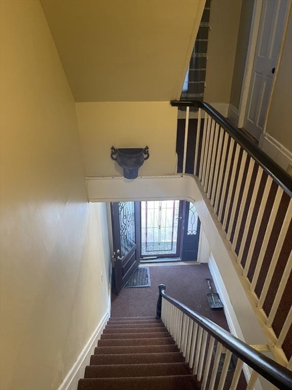 stairway with baseboards