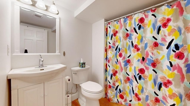 52 Sanborn St Unit 408, Reading, MA 01867 - full bathroom featuring visible vents, toilet, vanity, and a shower with curtain