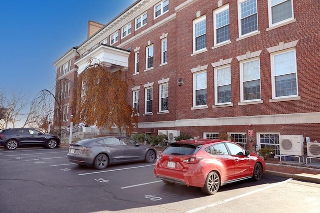 52 Sanborn St Unit 408, Reading, MA 01867 - view of building exterior featuring uncovered parking