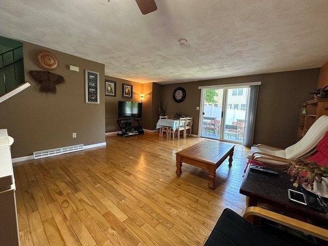 living room with light hardwood / wood-style floors