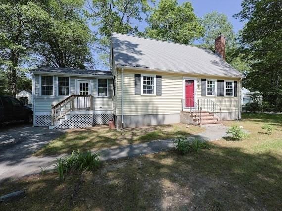 230 2nd St, Stoughton, MA 02072 - view of front facade featuring a chimney