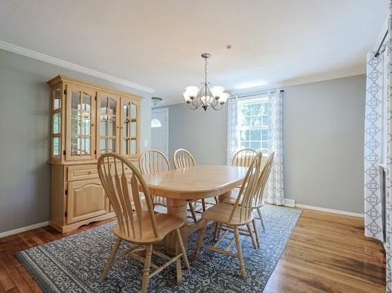 230 2nd St, Stoughton, MA 02072 - dining room with a chandelier, ornamental molding, baseboards, and wood finished floors