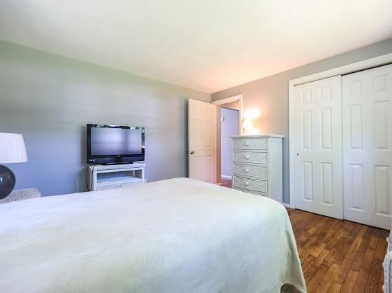 230 2nd St, Stoughton, MA 02072 - bedroom with dark wood finished floors and a closet