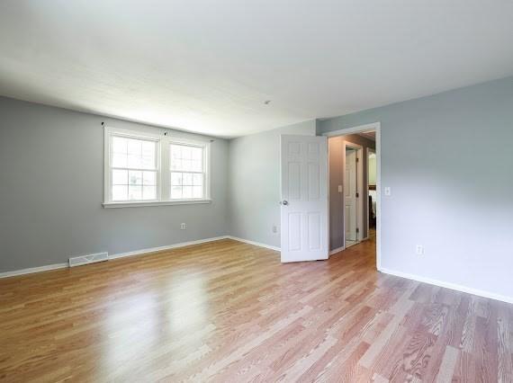 230 2nd St, Stoughton, MA 02072 - spare room with wood finished floors and baseboards