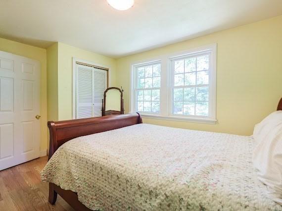 230 2nd St, Stoughton, MA 02072 - bedroom featuring wood finished floors and a closet