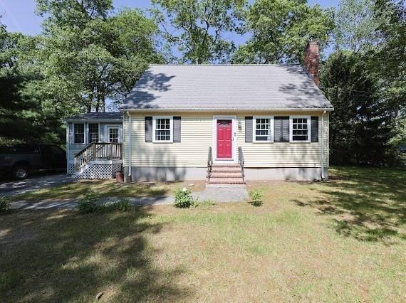 230 2nd St, Stoughton, MA 02072 - view of front facade with a chimney and a front lawn
