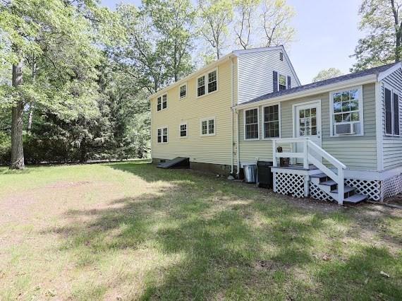230 2nd St, Stoughton, MA 02072 - rear view of property featuring a yard