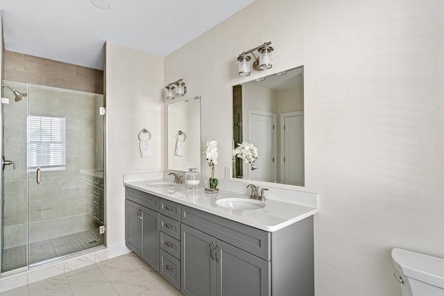 bathroom with walk in shower, vanity, and toilet