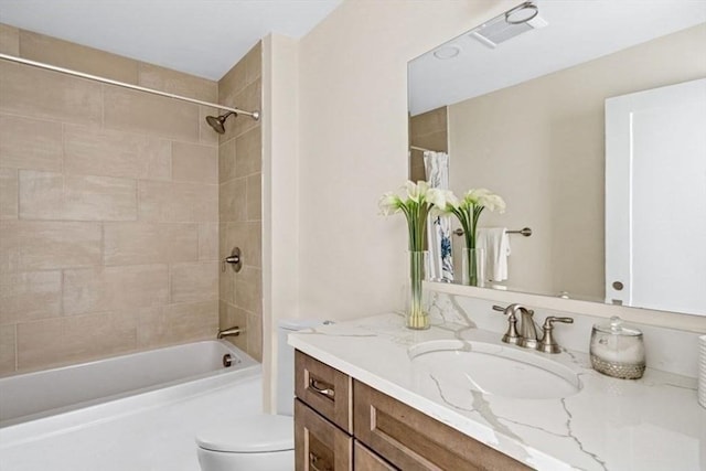 full bathroom with vanity, shower / bath combo, and toilet