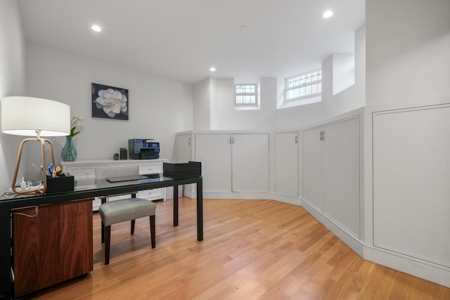 office space with light wood-type flooring