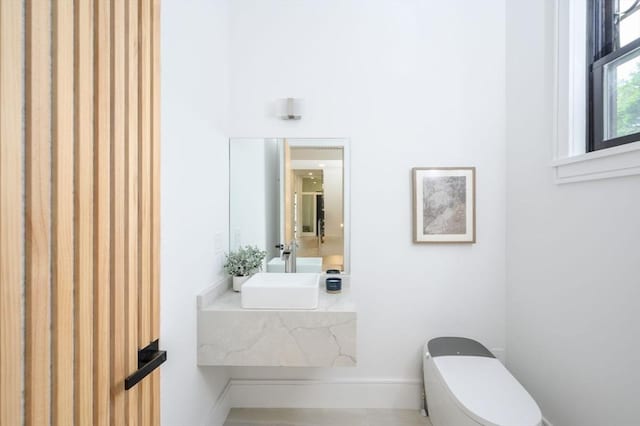 bathroom with sink and toilet