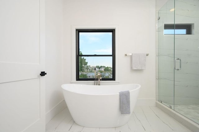 bathroom with separate shower and tub