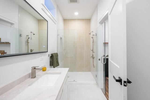 bathroom with an enclosed shower and vanity