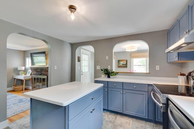 477 Laws Brook Rd, Concord, MA 01742 - kitchen featuring blue cabinetry, light countertops, and stainless steel appliances