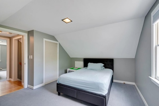 477 Laws Brook Rd, Concord, MA 01742 - bedroom with carpet flooring, lofted ceiling, baseboards, and multiple windows