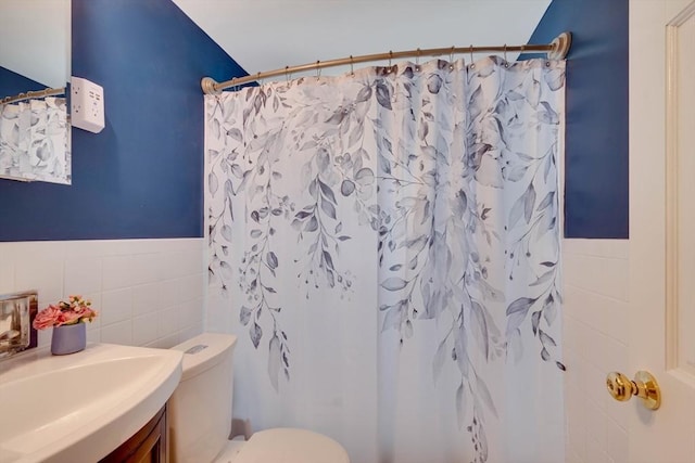 477 Laws Brook Rd, Concord, MA 01742 - bathroom featuring tile walls, wainscoting, vanity, toilet, and curtained shower