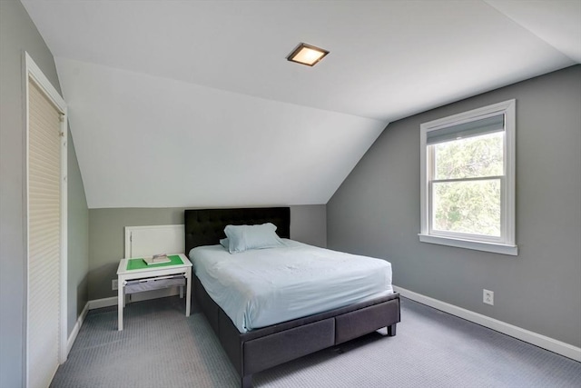477 Laws Brook Rd, Concord, MA 01742 - bedroom with lofted ceiling, baseboards, and carpet flooring