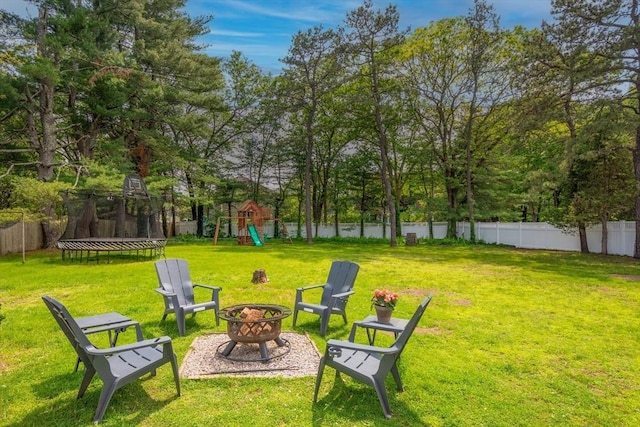 477 Laws Brook Rd, Concord, MA 01742 - view of yard with a trampoline, an outdoor fire pit, and a playground