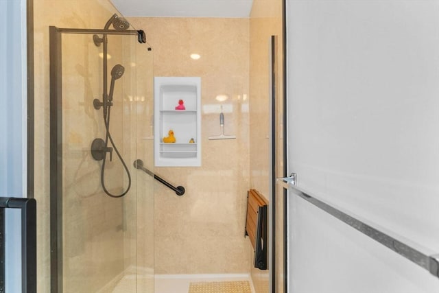 bathroom with a shower stall