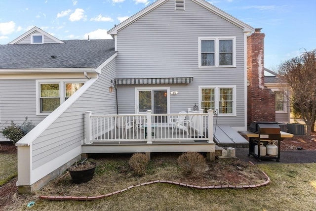 back of house featuring a wooden deck