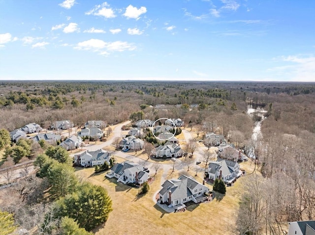 aerial view with a residential view and a wooded view