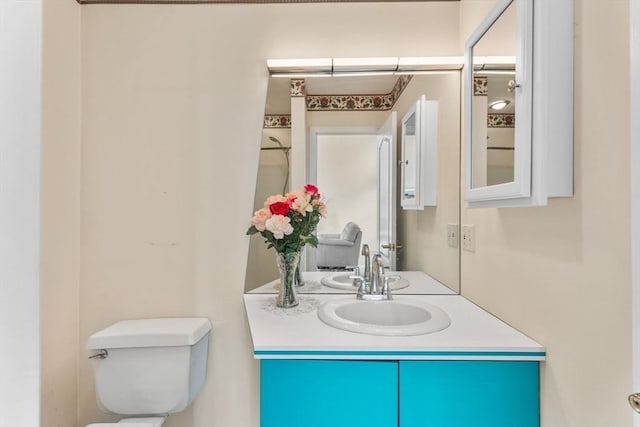 half bathroom with toilet and vanity