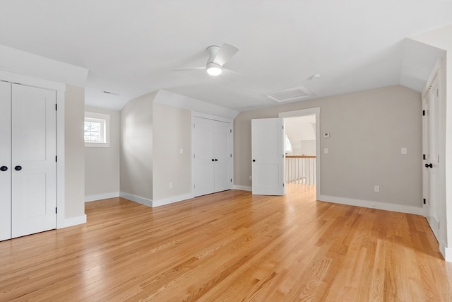 bonus room with ceiling fan, light hardwood / wood-style flooring, and vaulted ceiling