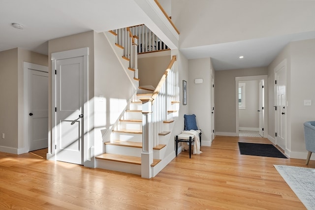 entrance foyer with a wealth of natural light and light wood-type flooring