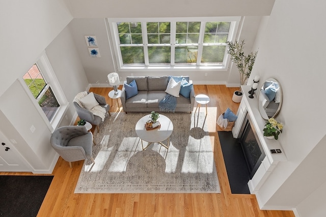 living room featuring a wealth of natural light and hardwood / wood-style flooring