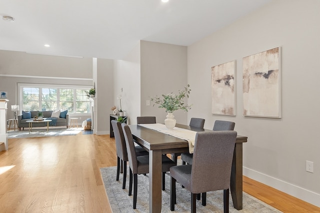 dining area with light hardwood / wood-style floors