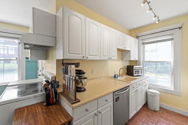 kitchen with stainless steel dishwasher, stove, extractor fan, white cabinetry, and a sink