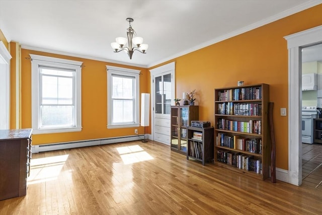 interior space featuring ornamental molding, a chandelier, wood finished floors, and baseboard heating