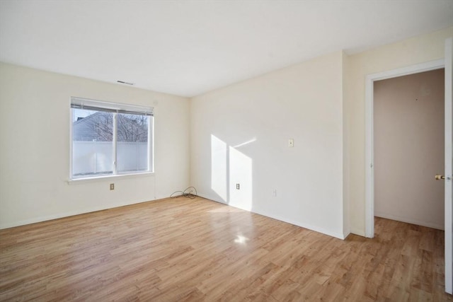 unfurnished room featuring light hardwood / wood-style flooring