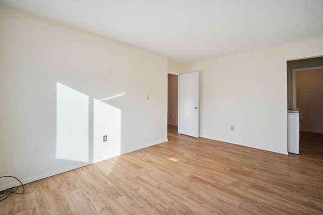 empty room with light wood-type flooring