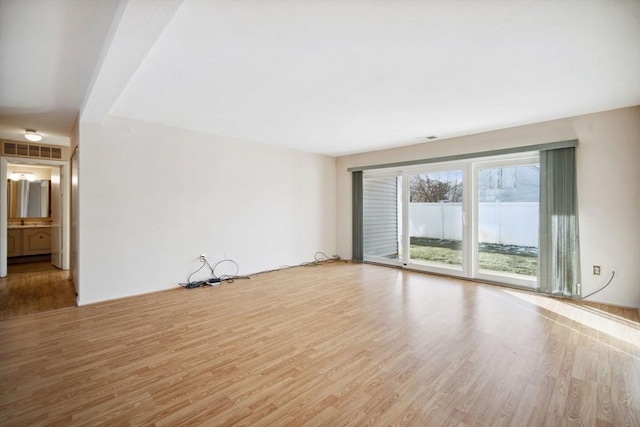 empty room with light wood-type flooring