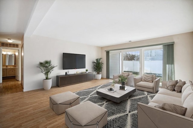 living room with light hardwood / wood-style floors