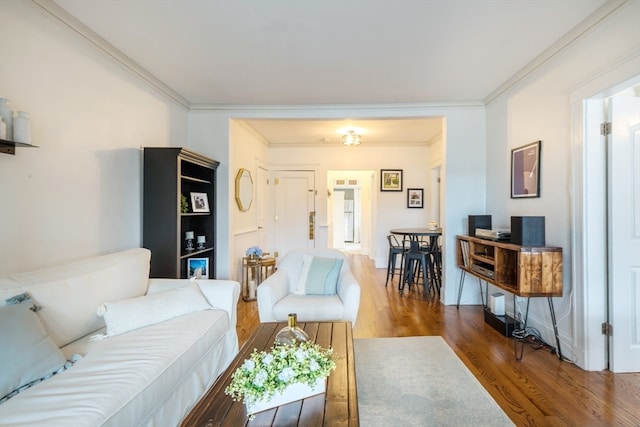 living room featuring crown molding and wood-type flooring