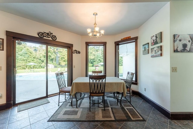 dining area featuring an inviting chandelier