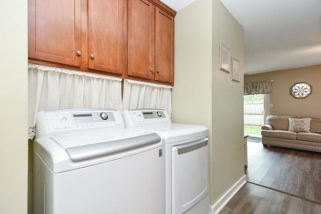 503 Dongary Rd Unit 503, Easton, MA 02375 - washroom featuring washer and dryer, cabinet space, and wood finished floors