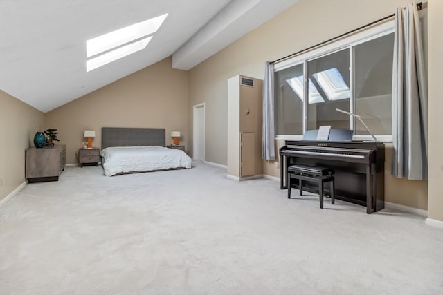 carpeted bedroom with lofted ceiling with skylight