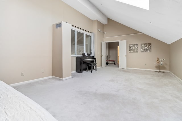 carpeted bedroom featuring high vaulted ceiling