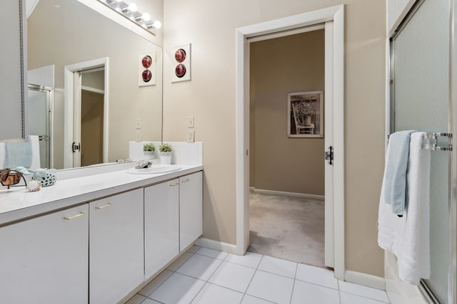 bathroom featuring tile flooring and large vanity