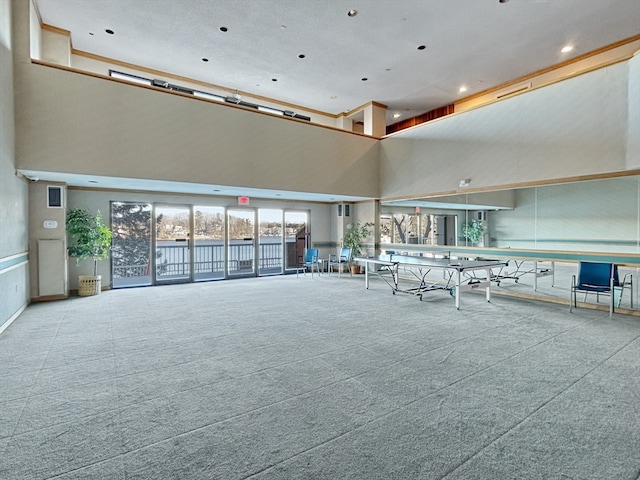 interior space featuring a towering ceiling