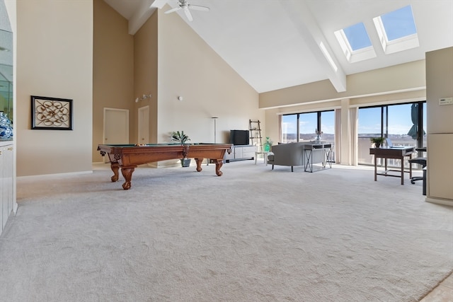 sitting room with ceiling fan, a skylight, light colored carpet, high vaulted ceiling, and pool table