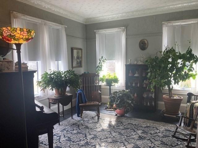 interior space with crown molding