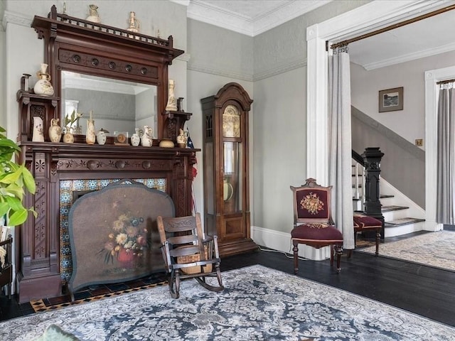 sitting room featuring dark hardwood / wood-style floors and ornamental molding