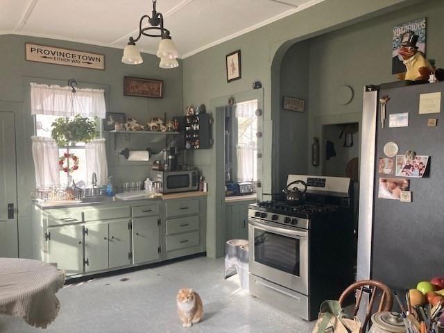 kitchen with pendant lighting and stainless steel appliances