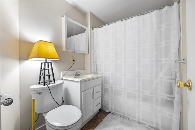 bathroom featuring toilet and vanity