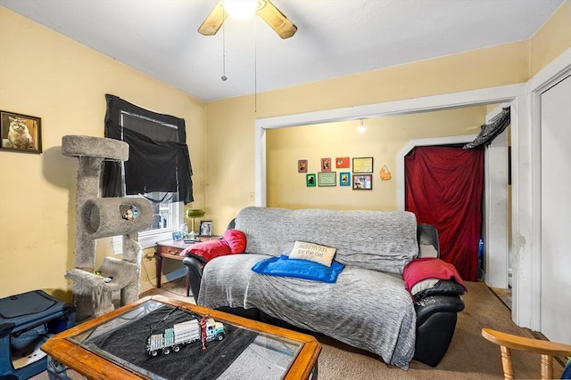 living room with carpet and ceiling fan