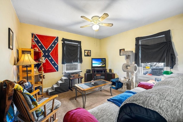 bedroom featuring ceiling fan and carpet